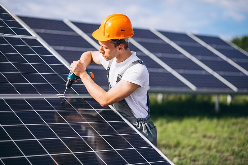 man worker firld by solar panels 1